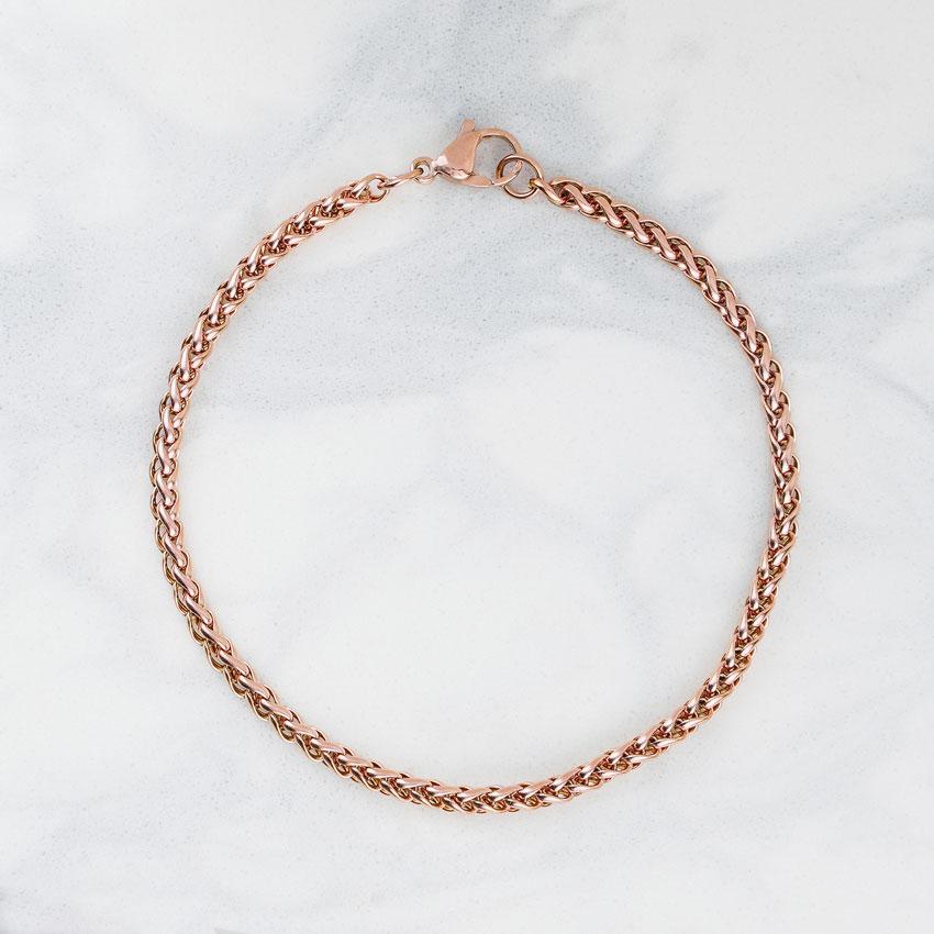 Our Rose Gold Wheat Chain Bracelet features our premium rose gold wheat chain and signature polished rose gold plate, engraved with RG&B.